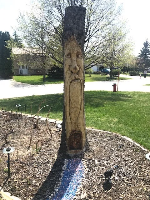 A carved ash tree trunk.